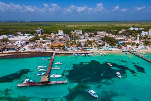 beachfront property Riviera Maya, luxury condos Puerto Morelos, Mexico real estate investment, vacation rental income Mexico, Quintana Roo condos for sale, high ROI-21