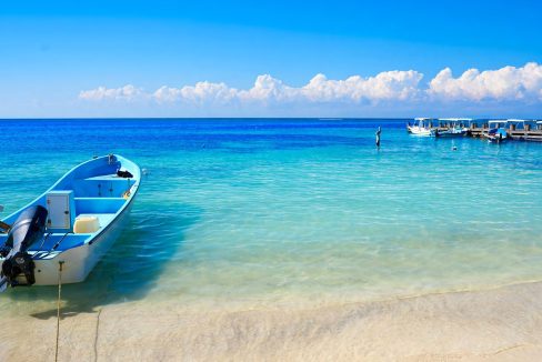 beachfront property Riviera Maya, luxury condos Puerto Morelos, Mexico real estate investment, vacation rental income Mexico, Quintana Roo condos for sale, high ROI-9